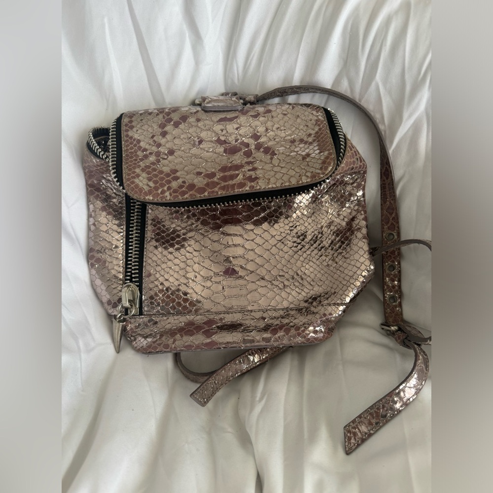 Giuseppe Zanotti mini backpack in a lavender color.